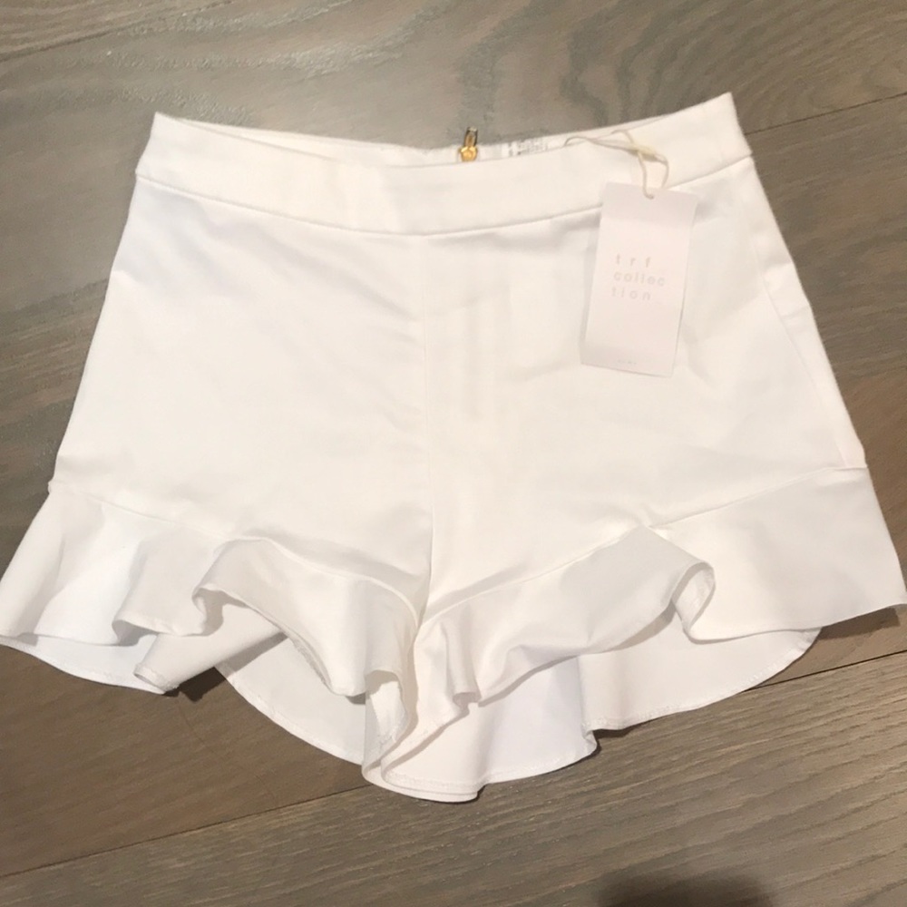 White high-waisted ruffle shorts